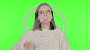 Angry Young Woman Arguing on Green Background