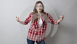 Angry young woman with checked shirt body language