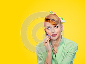 Angry young woman pinup girl talking on mobile phone