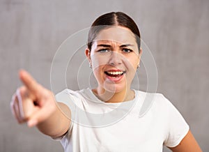 Angry young woman shouting aggressively