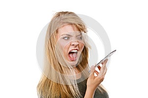 Angry young woman talking on phone