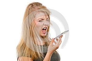 Angry young woman talking on phone