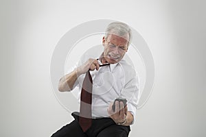 Anguished man reading a message on a mobile