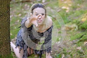 Anguished woman screaming and reaching up to the camera photo