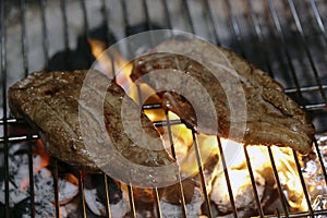 Angus steaks on a barbecue