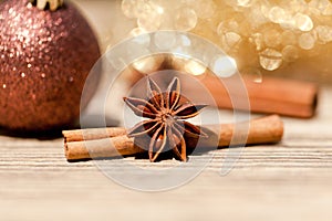Anice cinnamon and bauble christmas decoration in gold photo