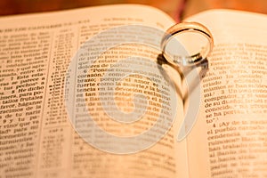 wedding rings over bible photo