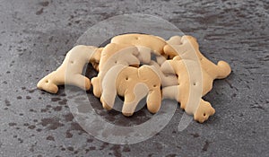 Animal crackers on a gray background side view