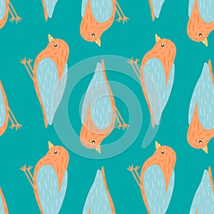 Animal flying seamless pattern with orange colored bird silhouettes. Blue bright background