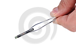 Animal implant on tweezers