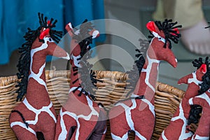 Giraffe souvenir from textil lie in a basket at Diani Beach, Kenya photo