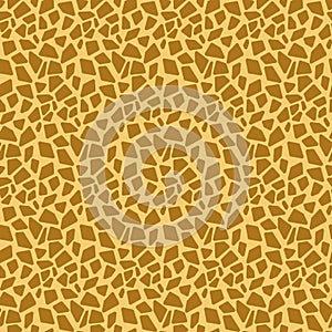 Animalistic seamless pattern giraffe skin, imitation of a giraffe pattern on yellow orange brown fabric