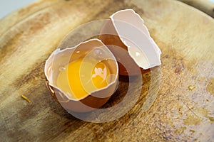 Chicken eggs and yellow yolk isolated on white background. photo