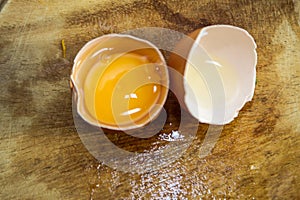 Chicken eggs and yellow yolk isolated on white background. photo