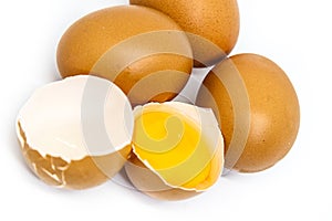 Chicken eggs and yellow yolk isolated on white background. photo