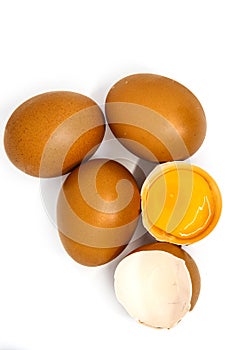 Chicken eggs and yellow yolk isolated on white background. photo