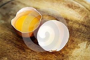 Chicken eggs and yellow yolk isolated on white background. photo