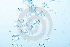 Animated bubbles in clear blue water splash on white background