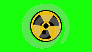 Animated radiation spinning around. Nuclear sign symbol rotate around isolated on green background. Yellow radioactive sign