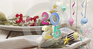 Animation of 20254 text and christmas place setting and decorations in background