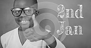 Animation of 2nd jan text over happy african american schoolboy on grey background