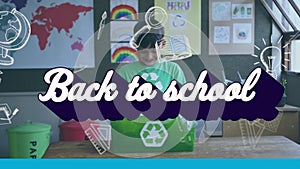 Animation of back to school text and icons over schoolboy holding recycling box