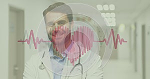Animation of beating heart and heartbeat symbol over smiling male doctor with stethoscope