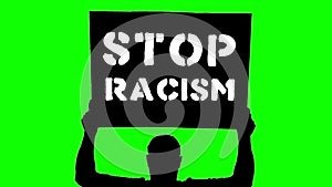Animation. black silhouette of protester holds poster, banner above his head, with slogan- Stop Racism. Green background