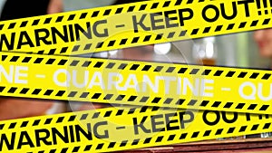 Animation of black and yellow tapes with black and white texts Warning Keep Out Quarantine