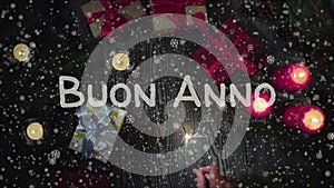 Animation Buon Anno - Happy New Year in italian, female hand holding a sparkler