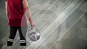 Animation of caucasian amercian football player over light trails and spots on grey background