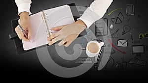 Animation of caucasian businessman taking notes over business icons