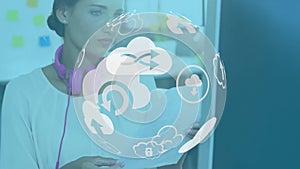 Animation of Caucasian woman wearing headset and using computer over globe of social icons spinning