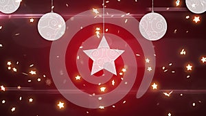 Animation of christmas boubles and stars falling over red background