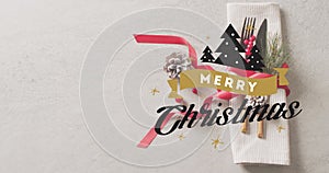 Animation of christmas greetings text over christmas place setting