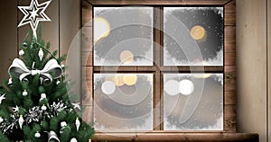 Animation of christmas tree window over snow falling and cars