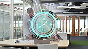 Animation of clock moving fast over business colleagues using laptop in office