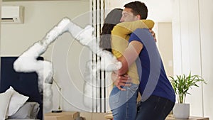 Animation of cloud house icon over happy diverse couple embracing in new home
