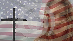 Animation of cross and Caucasian woman over flag of usa