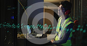 Animation of data processing against asian male engineer using laptop at computer server room