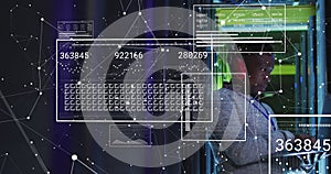 Animation of data processing over african american male engineer using laptop at server room