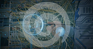 Animation of data processing over hands of caucasian man holding computer wires