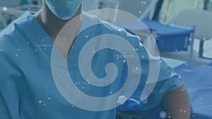Animation of data processing over portrait of caucasian female surgeon in operating theatre