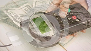 Animation of dollar banknotes falling over hand of caucasian man holding payment terminal