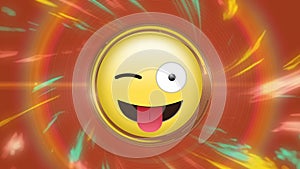 Animation of emoticon with winking eye and sticking out tongue over illuminated abstract background