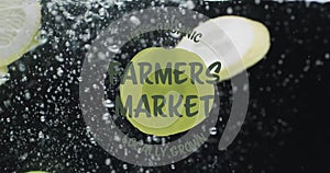Animation of farmer market text over fruit falling in water background
