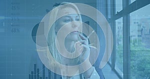 Animation of financial data processing over caucasian businesswoman in office