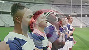 Animation of flag of algeria over diverse male rugby players singing anthem at stadium