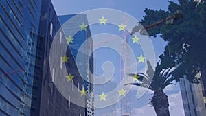 Animation of flag of european union over fast motion crane and high rise buildings in modern city