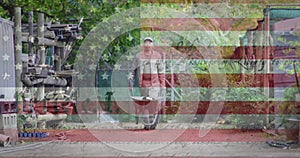 Animation of flag of united states of america over male gardener with wheelbarrow